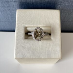 White Gold and Diamond Engagement Ring with Halo and Yellow Prongs