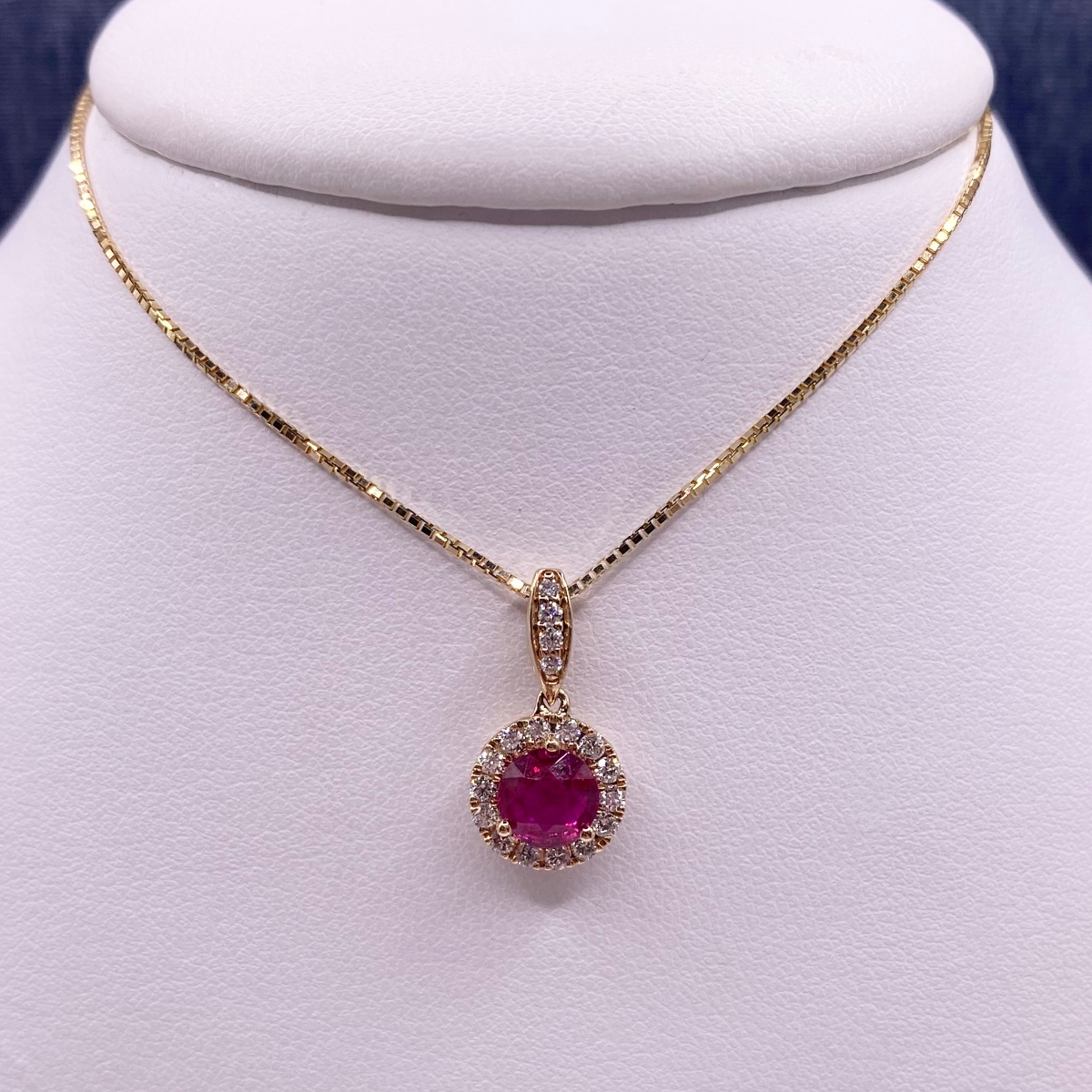 Ruby Pendant in Yellow Gold with Diamond Halo